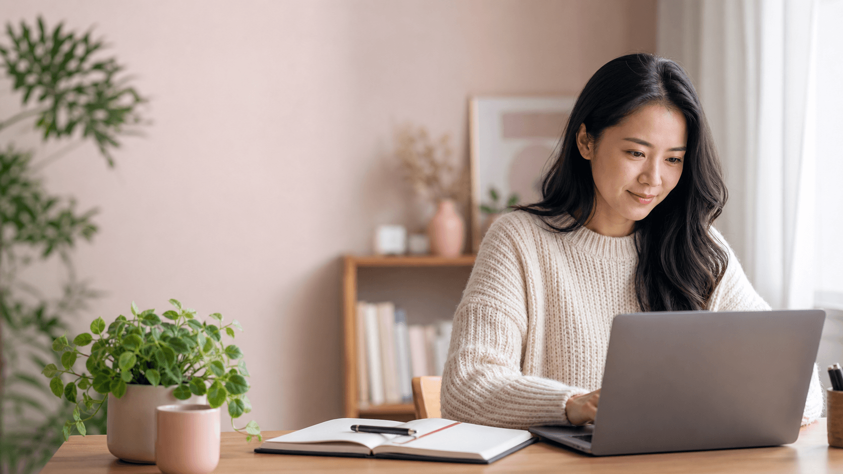 A learner using a laptop, notebook, and quiet workspace to build a practical new skill.